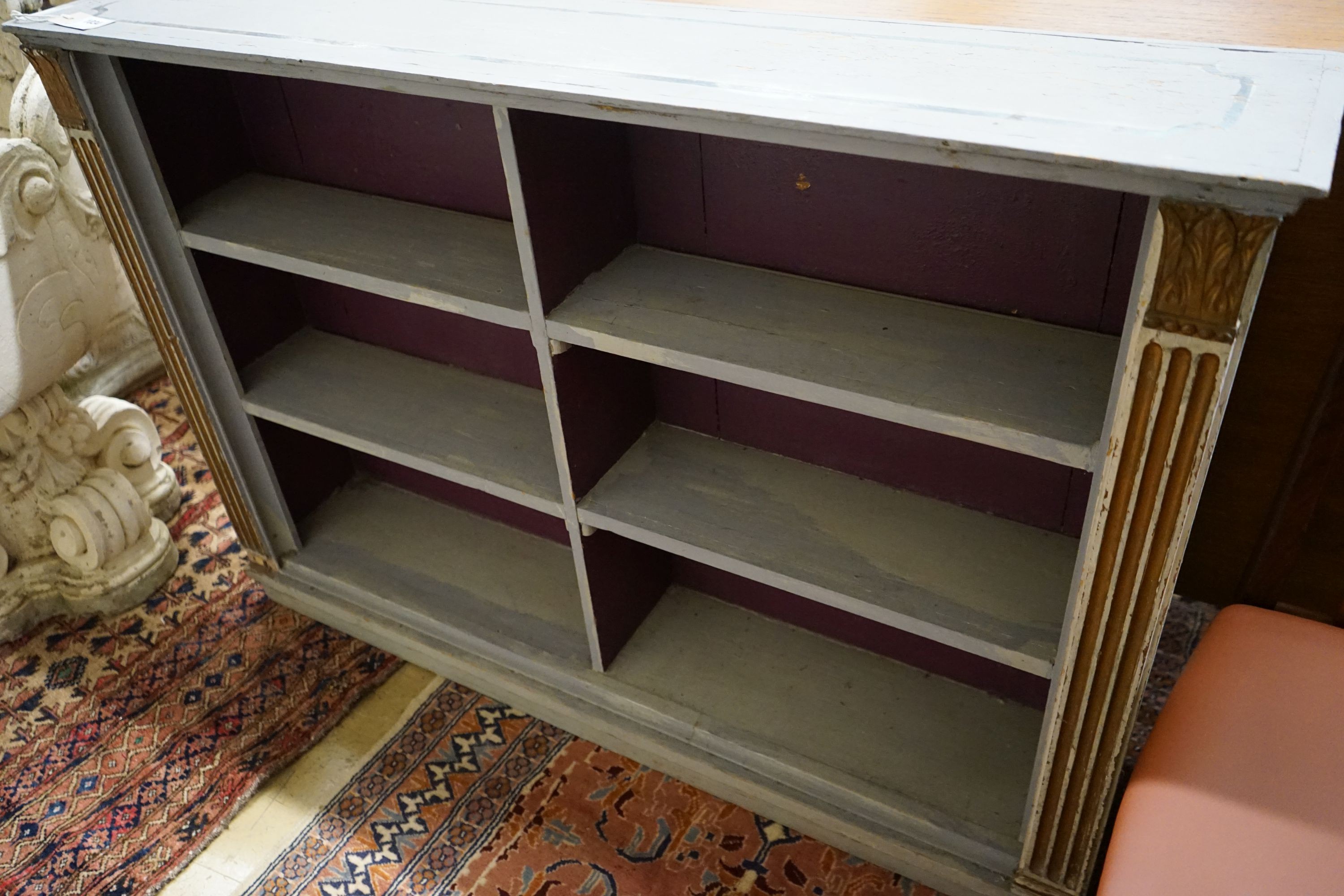 A blue painted pine open bookcase, width 120cm, depth 24cm, height 83cm